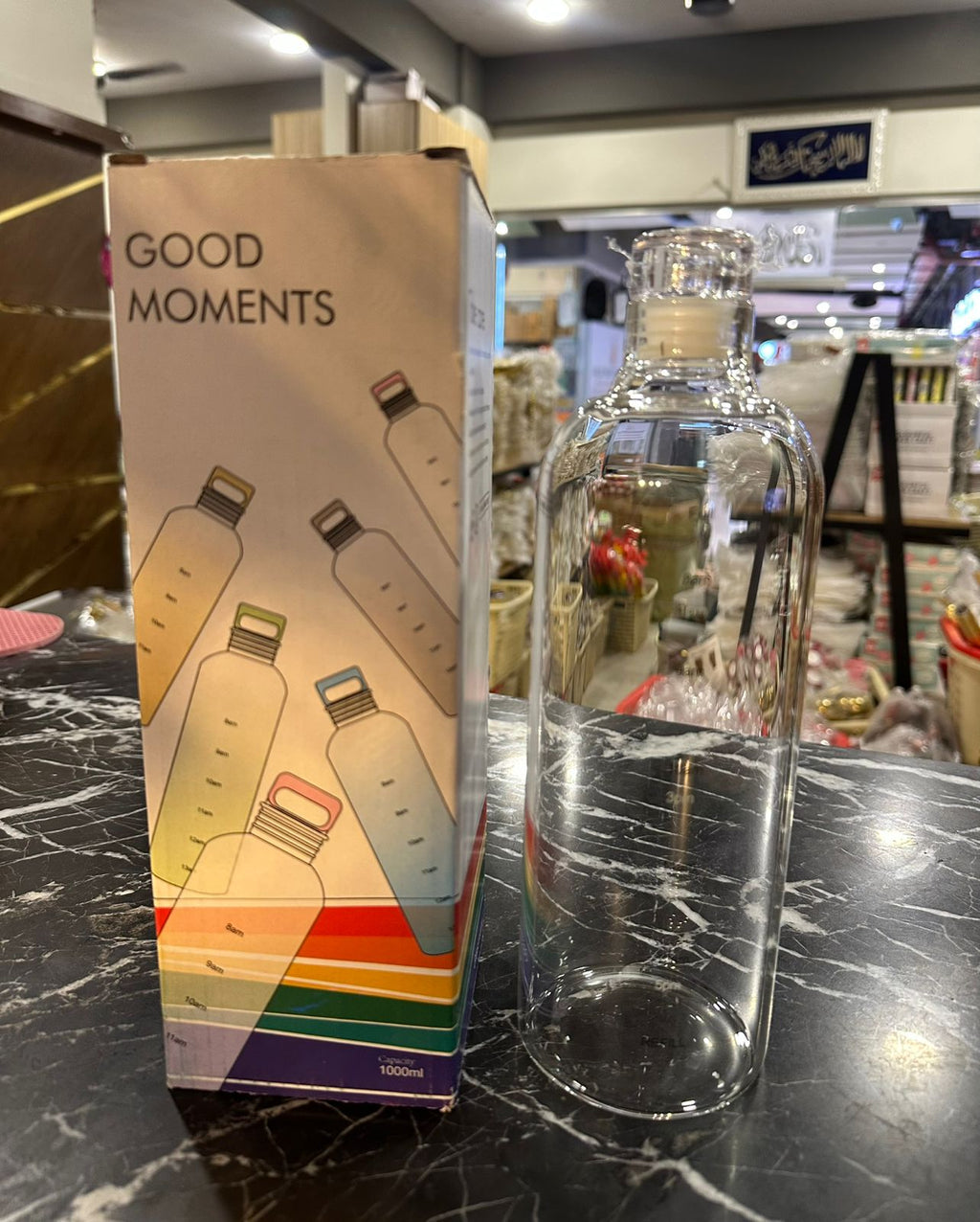 Glass water bottle with GOOD MOMENTS retail box