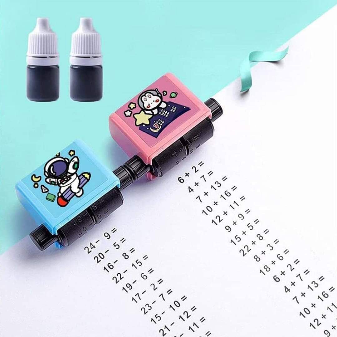 Reference photo of blue and pink math stamp rollers with two ink bottles and printed addition and subtraction examples