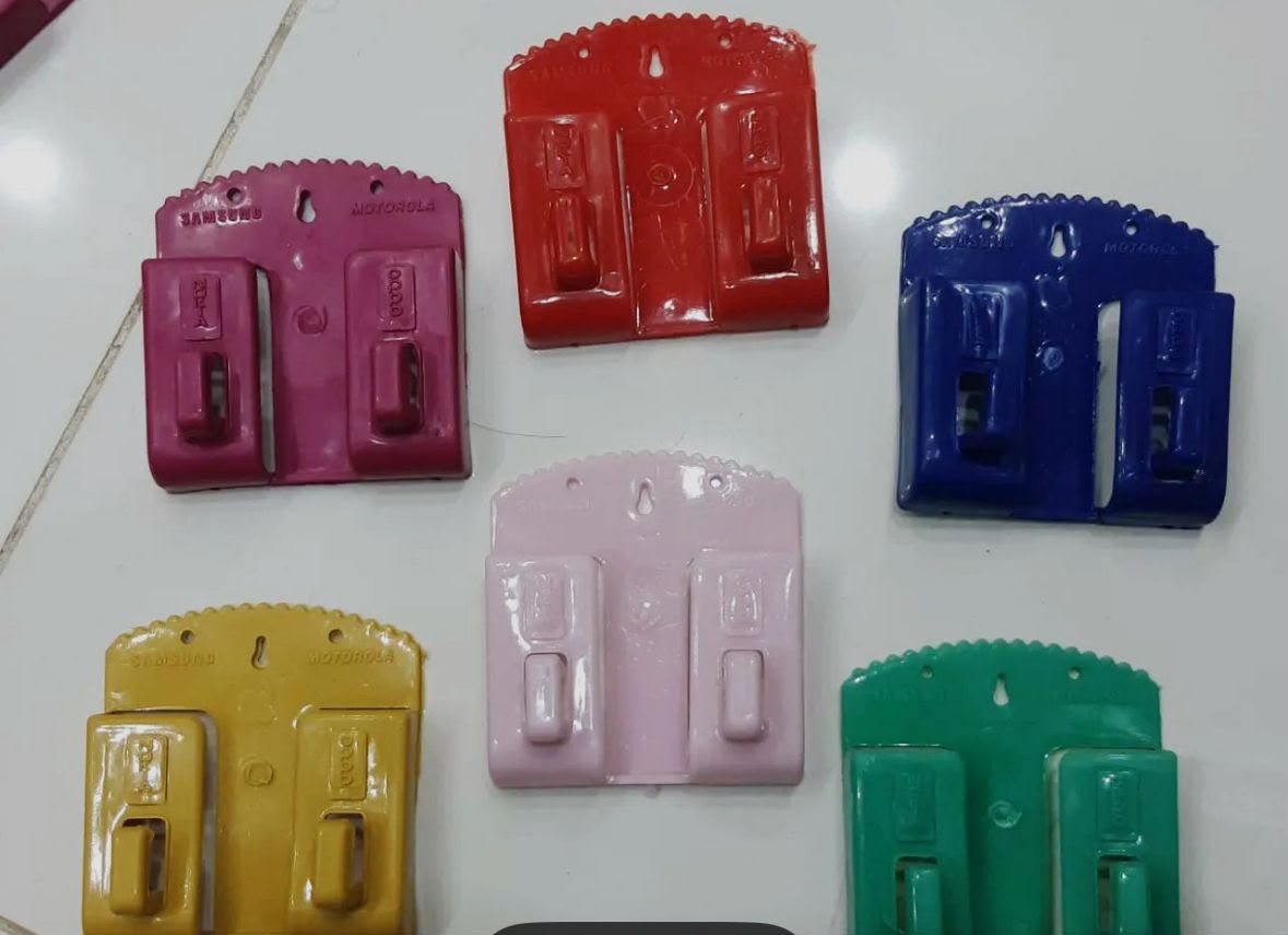 Actual wall mount mobile phone holders in assorted colours with scalloped backplates and twin folding supports