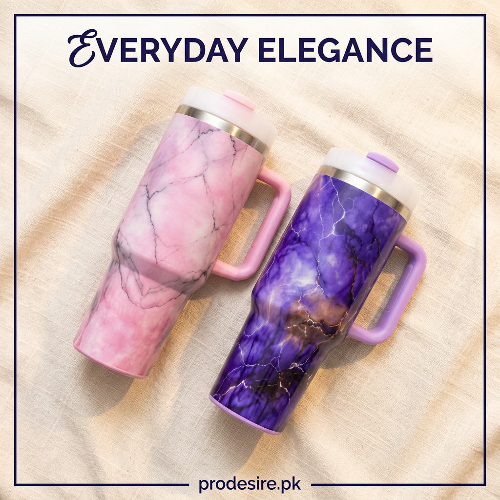 Overhead view of pink and purple marble printed handled tumblers on cream linen